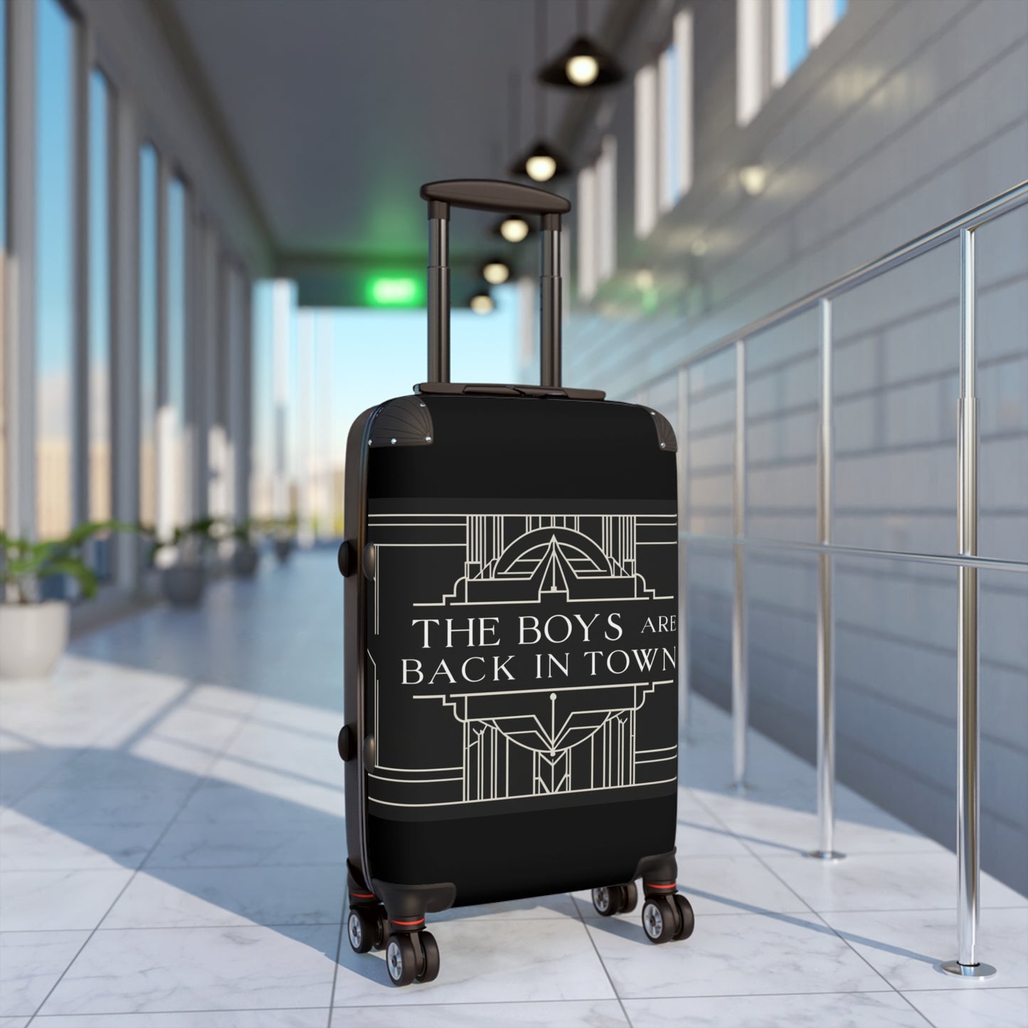 Stylish Black Suitcase with 'The Boys Are Back in Town' Design