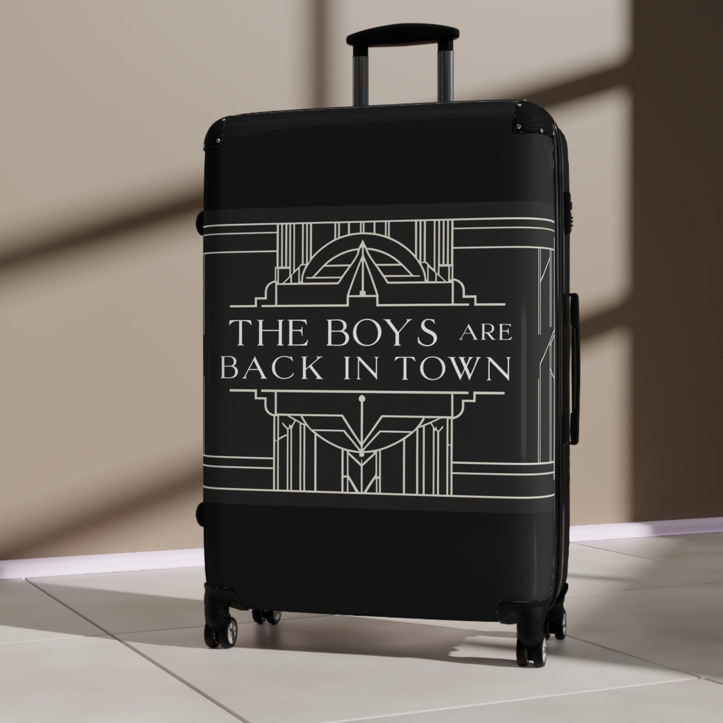 Stylish Black Suitcase with 'The Boys Are Back in Town' Design