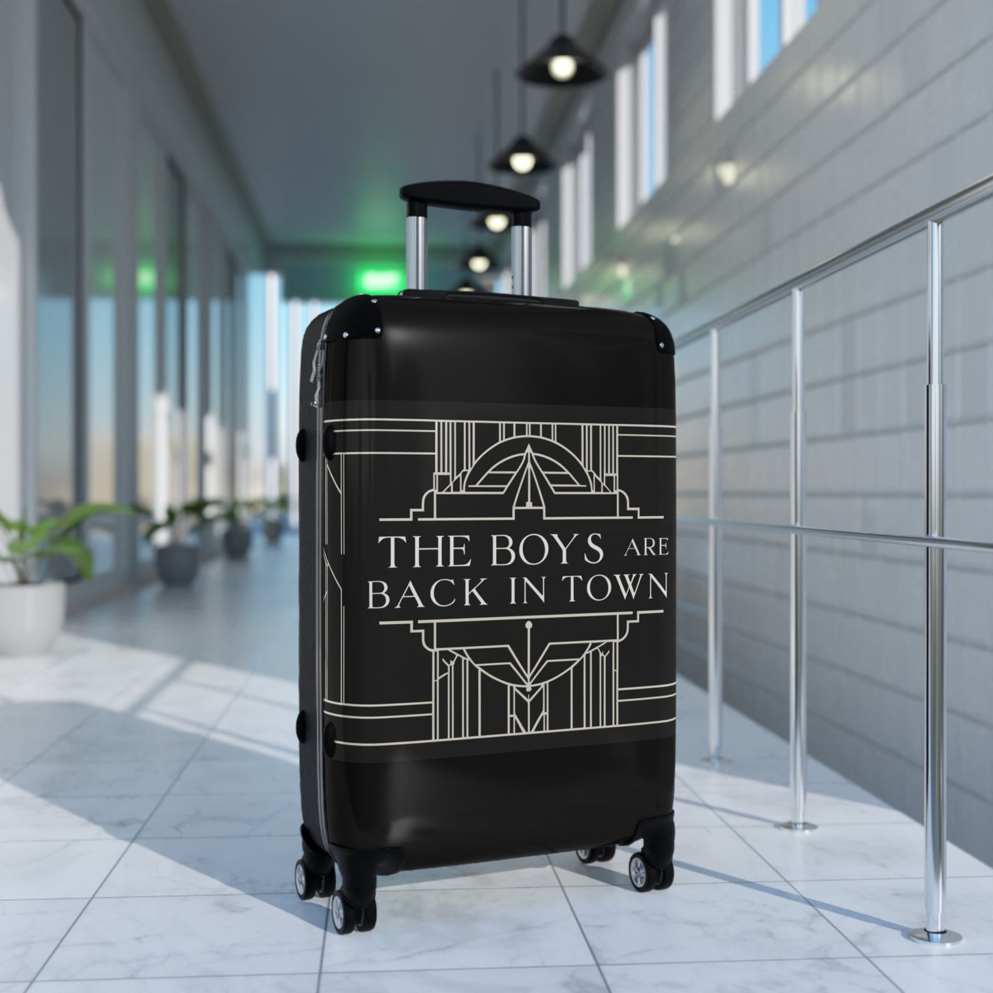 Stylish Black Suitcase with 'The Boys Are Back in Town' Design