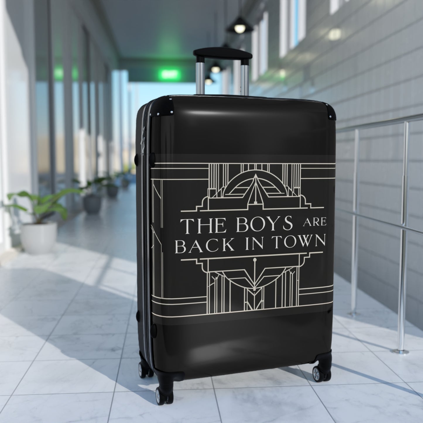 Stylish Black Suitcase with 'The Boys Are Back in Town' Design